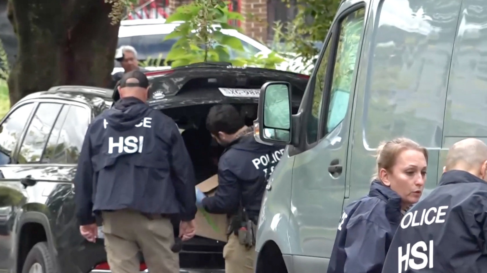 HSI agents loading boxes outside Ilhan Omar's home