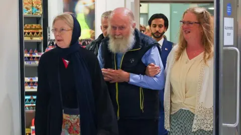 British Couple Freed from Taliban Custody Returns to the UK