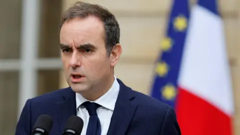 French Political Crisis: Outgoing PM Awaits Resolution as New Elections Loom
