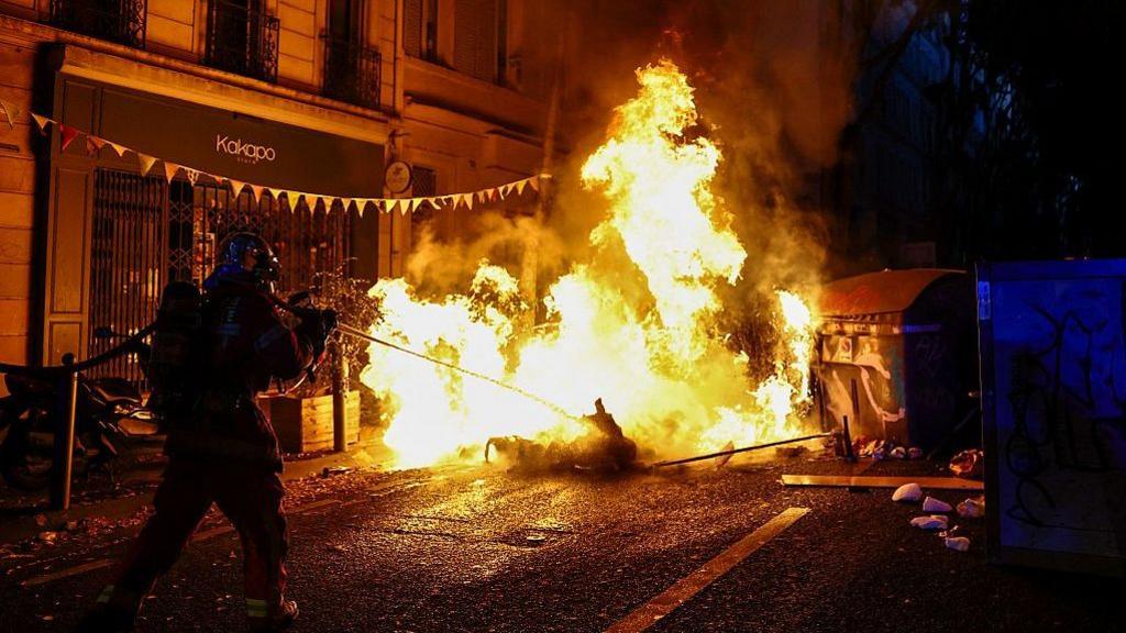 A burning makeshift street barricade in Marseille