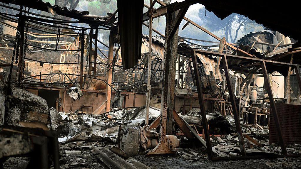 Charred remains of a home burned in Madrid
