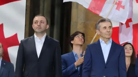 The Downfall of Georgia's Former Prime Minister: A Tale of Corruption and Betrayal