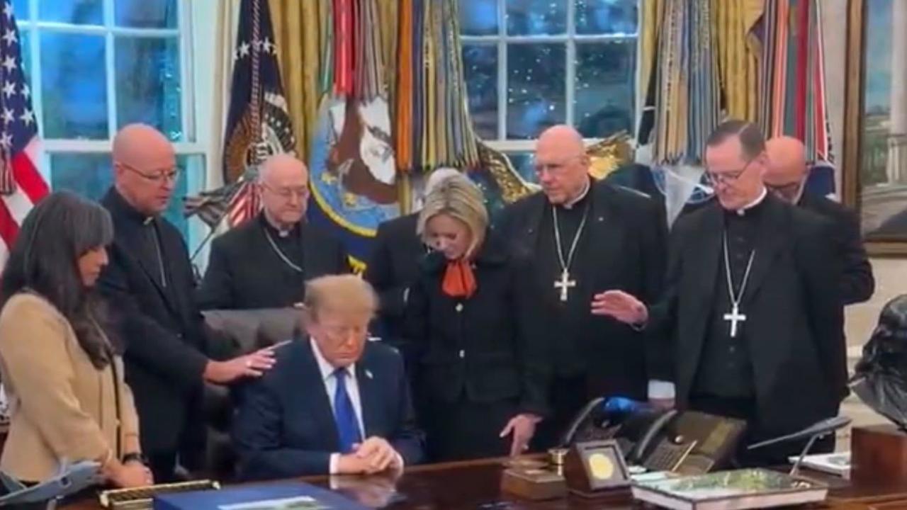 Bishops praying with Donald Trump in the Oval Office