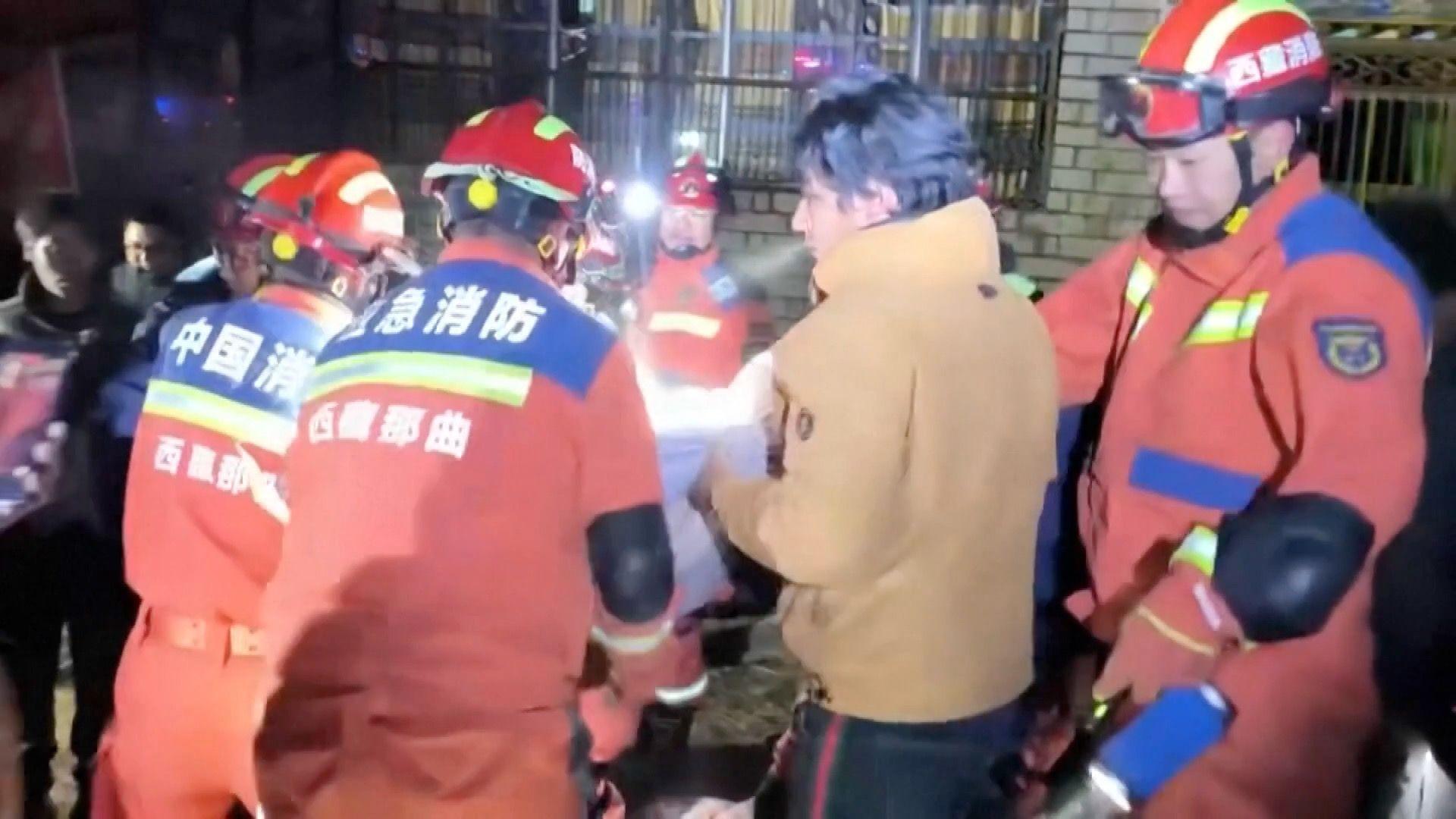 Firefighters aiding residents amid rubble in Baqên